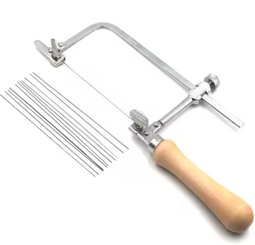 Jeweler's saw frame kit comprising 12 adjustable blades, designed for precision cutting of metal and wax rings, serves as an essential tool for jewelry making.